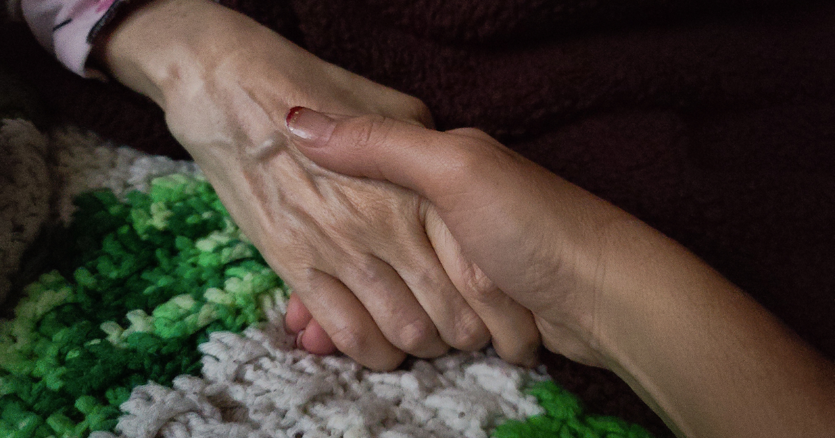 Holding-hand-Caregiver-at-senior1Care