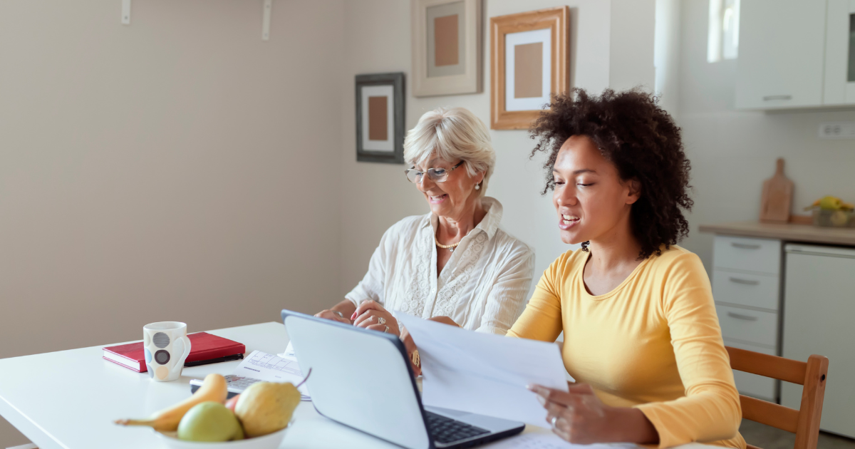 A daughter is assisting her senior mother manage her finances.