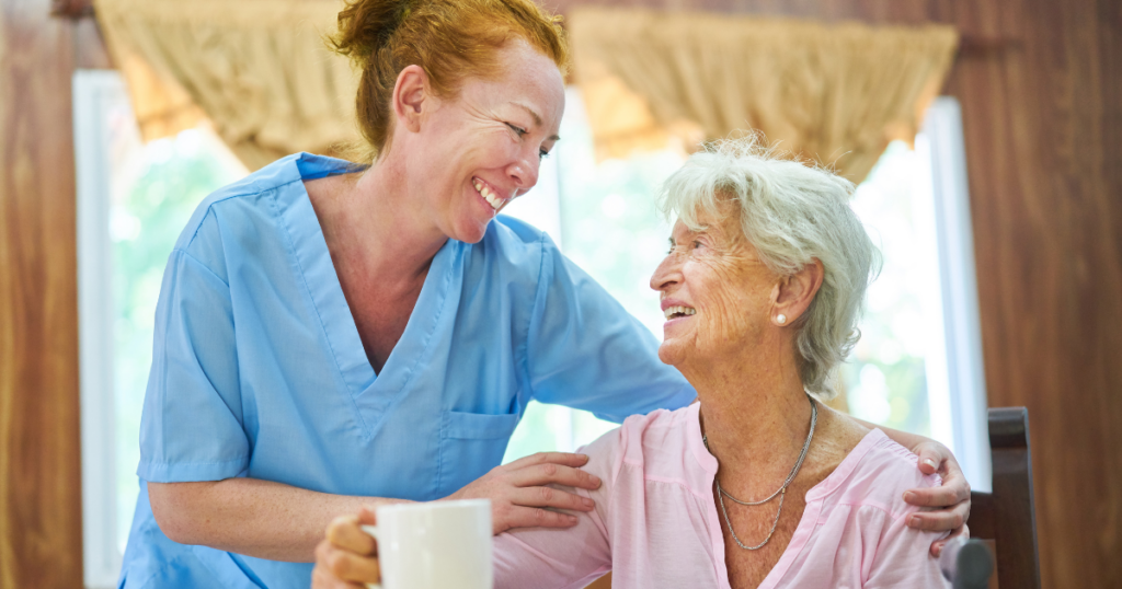 A caregiver provides home care services with a compassionate touch that helps her senior client stay happy and independent at home.