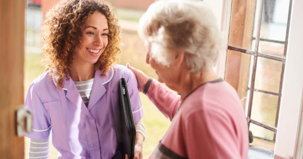 A woman enjoys her career in caregiving as she visits a client.