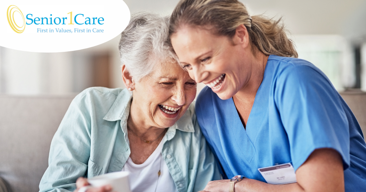 A woman who is providing companion care and her senior client laugh and enjoy their time together.