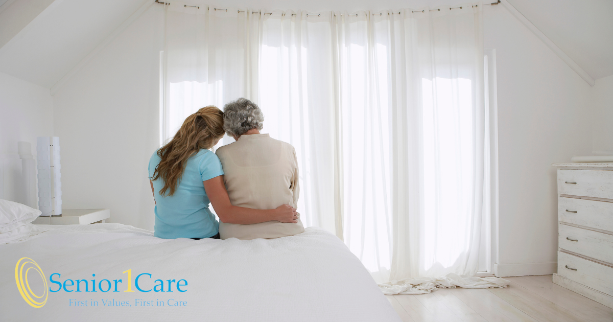 A family caregiver hugs her loved one and is better able to enjoy her time with her after taking a break by using respite care services.