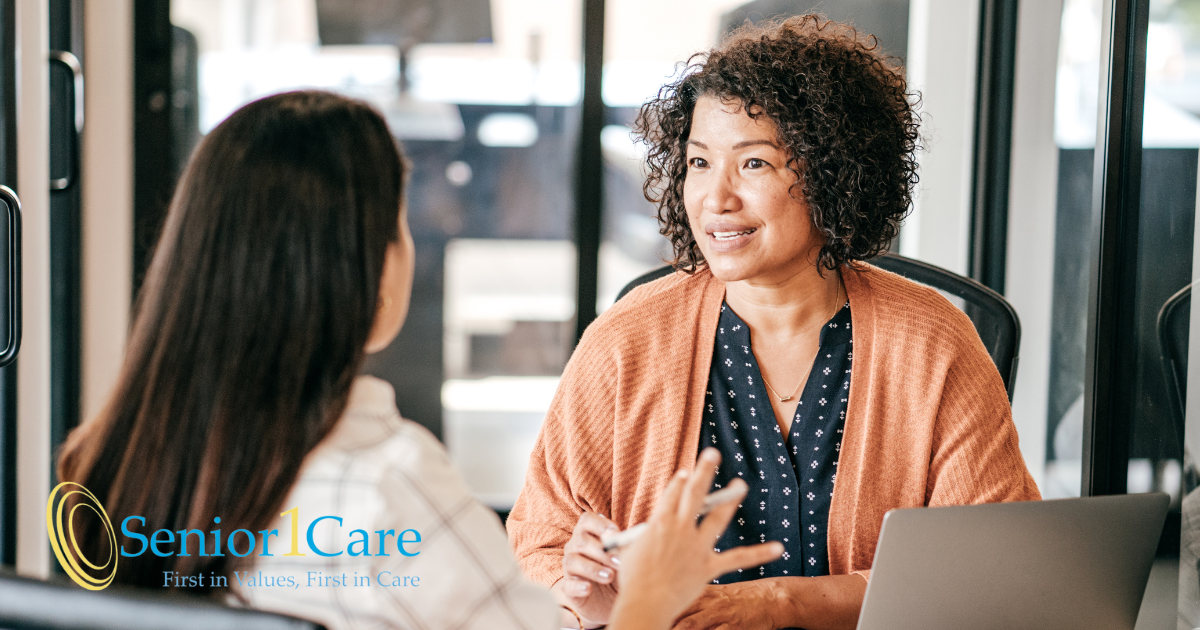 A woman interviews another woman for a caregiver job position.