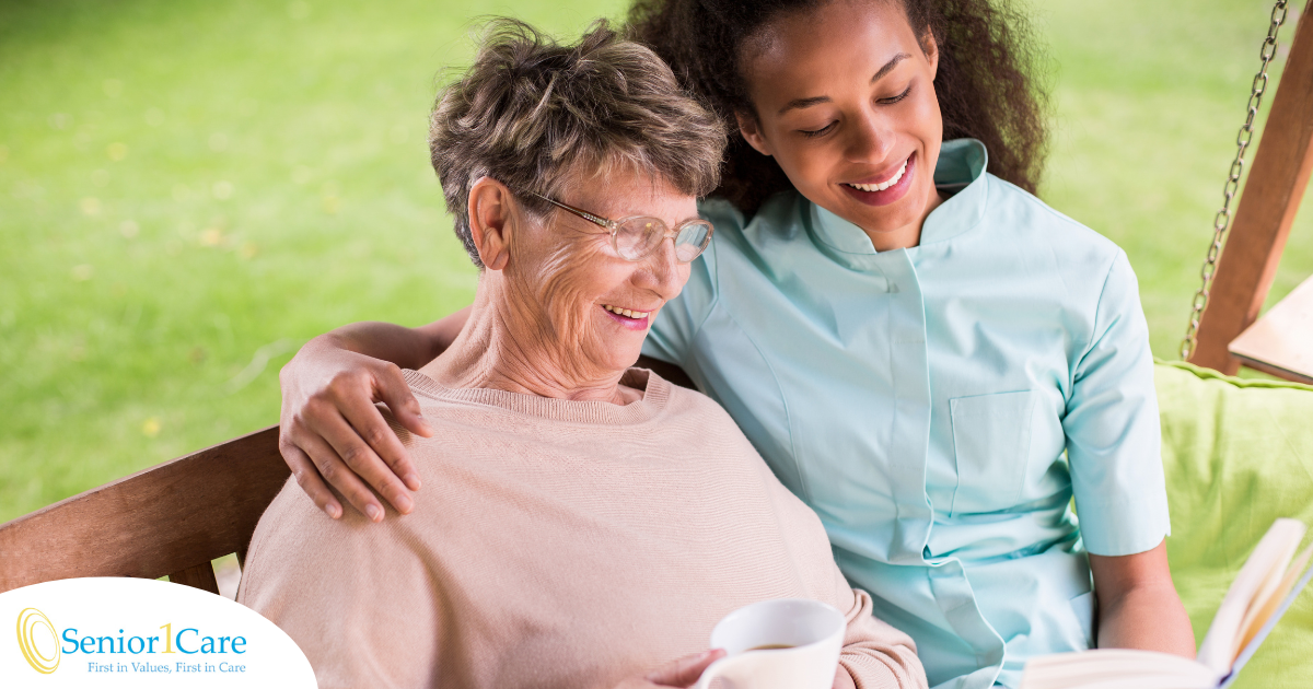 Professional caregivers like this one who is reading a book with a senior client can help them stay mentally active and engaged.