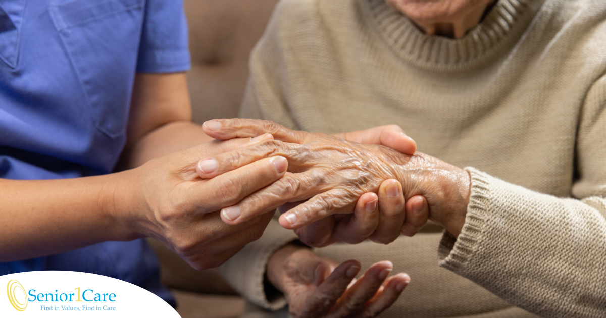 A nurse check where a patient’s hand is hurting in order to help with pain management.