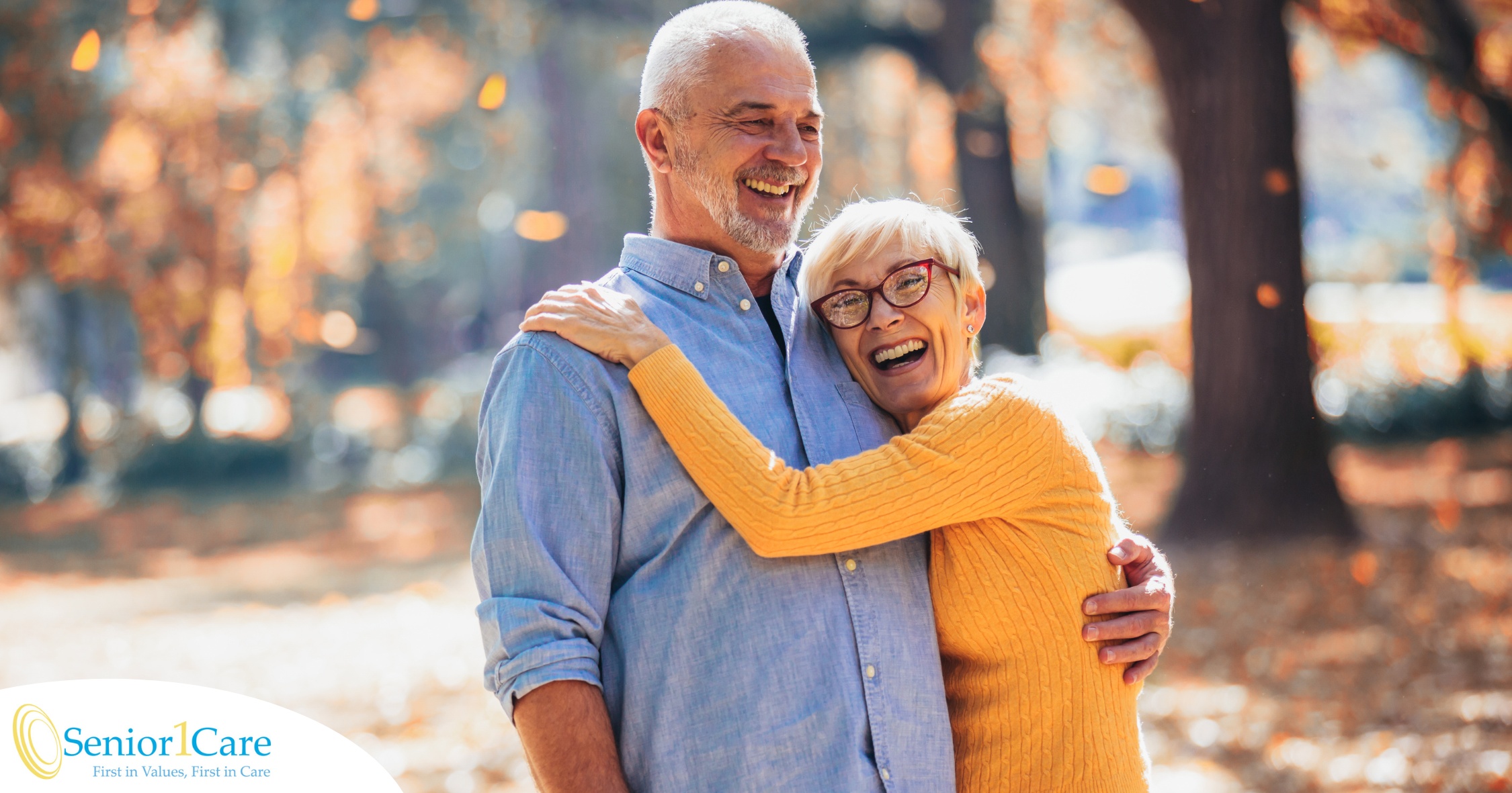 An older couple enjoys being outside in the fall, representing the idea of different fall activities for seniors.