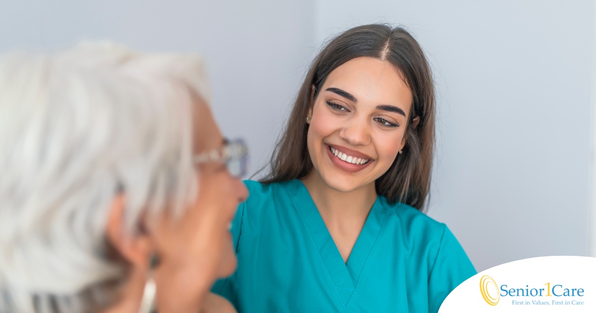 A caregiver smiles with an older client showing the results of successfully starting a new caregiving job.