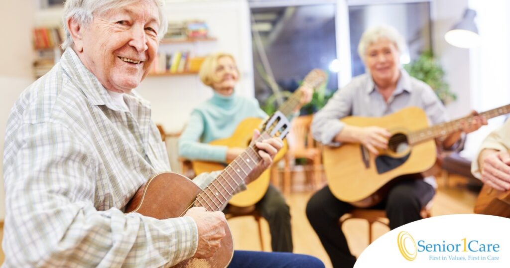 A compassionate young caregiver with a stethoscope around her neck gently looks after an elderly woman sitting on a couch, showing the warmth and connection possible through in-home care.