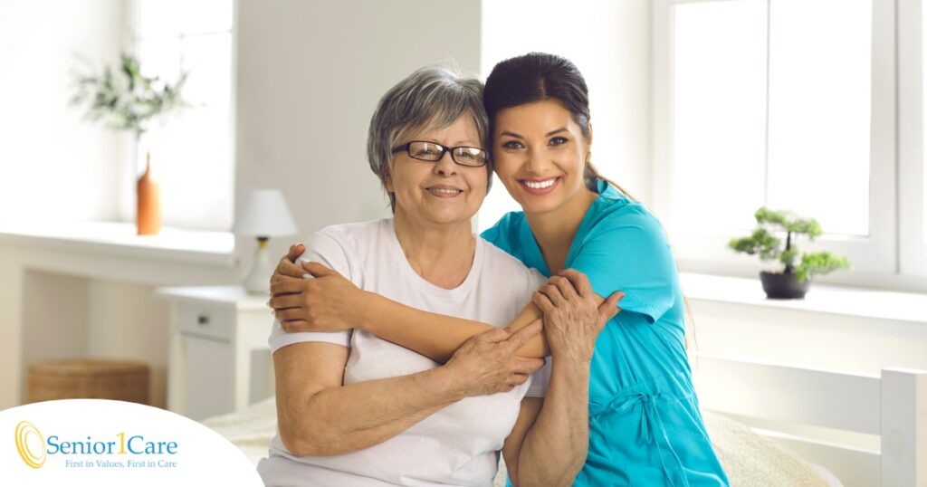 A caregiver hugs an older client, representing how a trustworthy caregiver cares for clients.