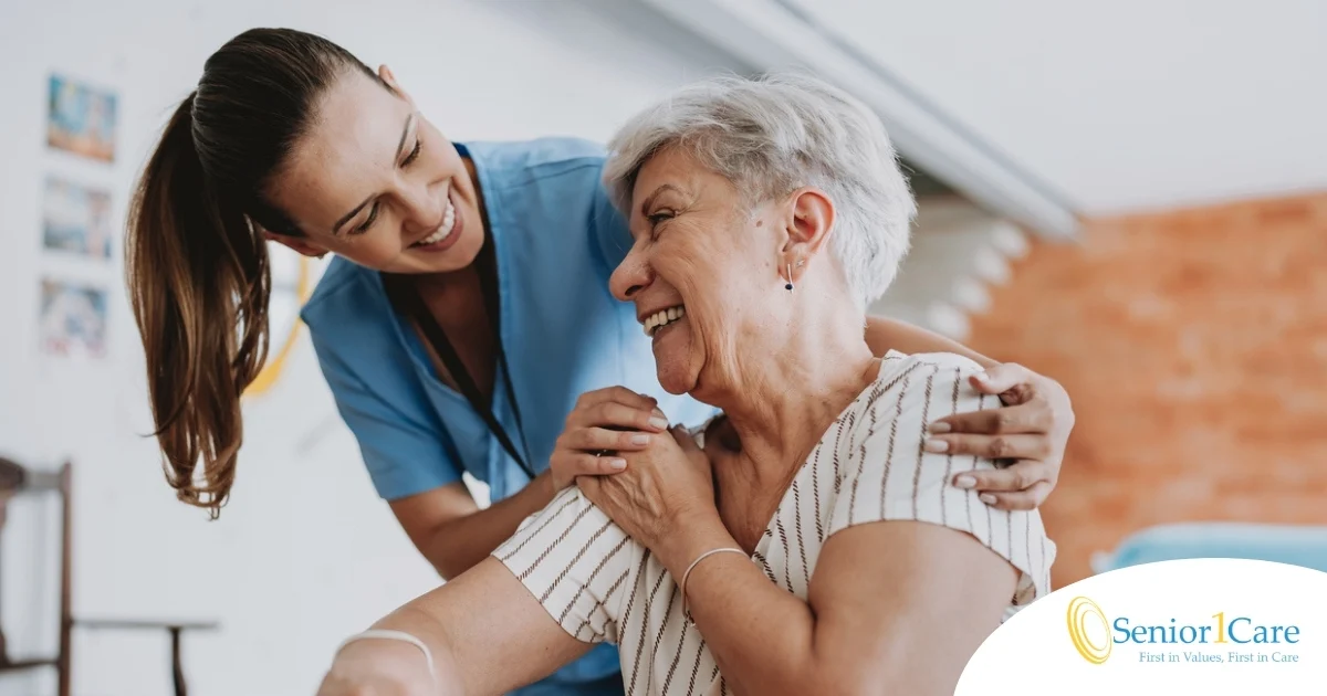 A female caregiver helping an older woman with stroke recovery at home.